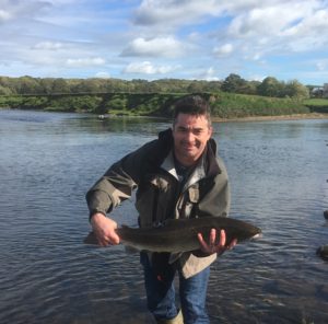 Angler with big salmon from River Ribble